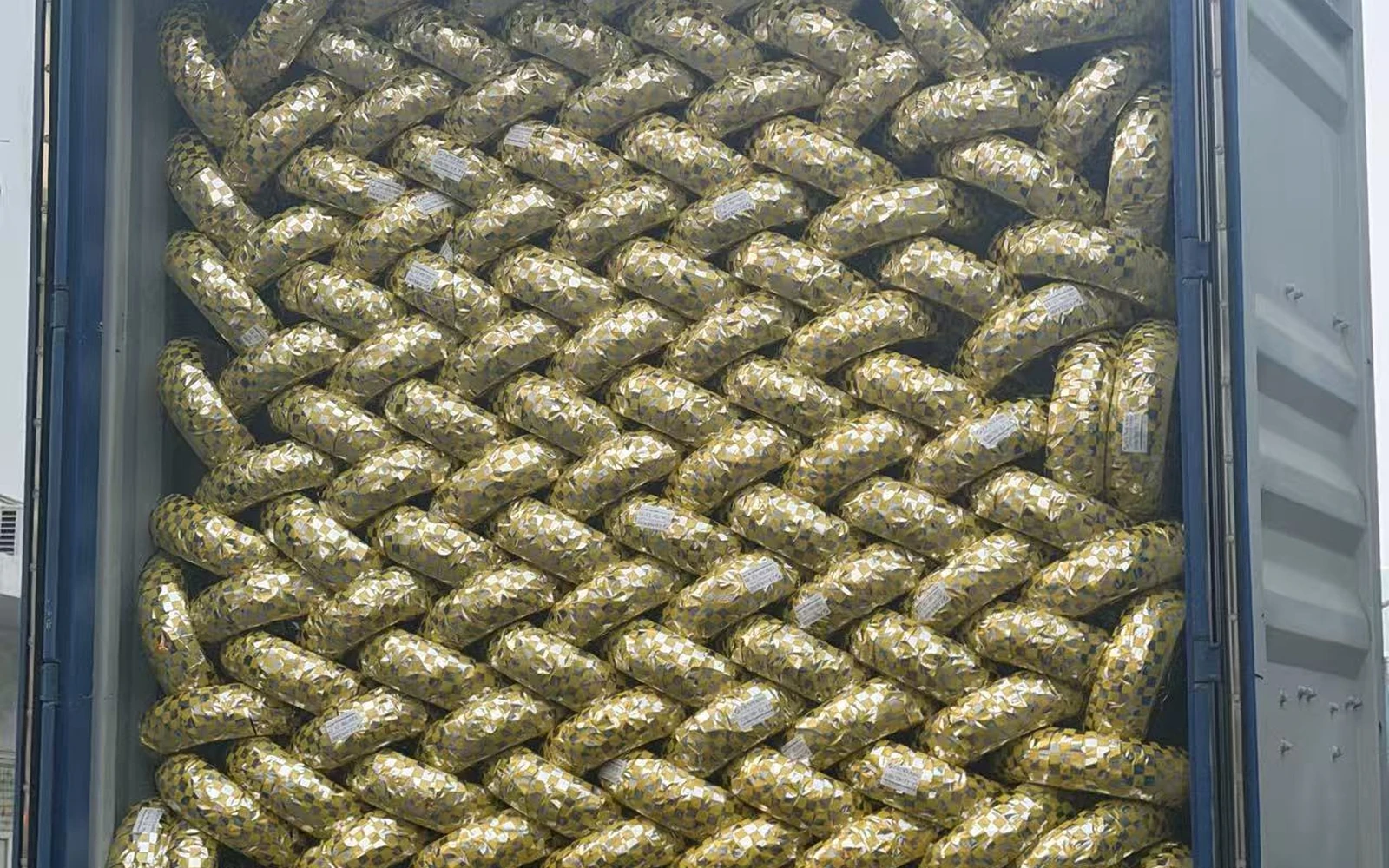 Wrapped motorcycle tires loaded inside an export container